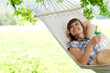 Young woman resting on hammock