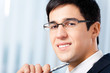 Portrait of smiling businessman at office