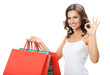 Young happy woman with shopping bags, isolated