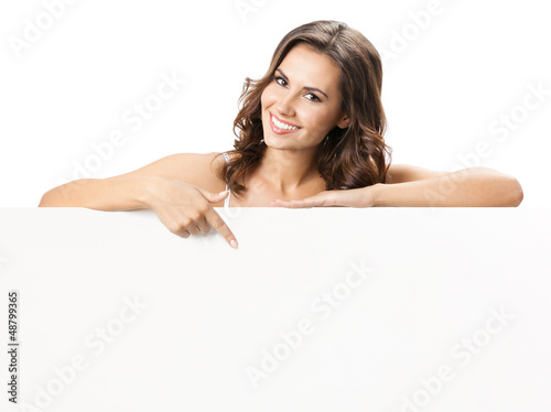 Photo: Beautiful young woman with blank signboard Beautiful young woman with blank signboard