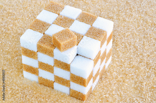 Photo: Cube of brown and white sugar cubes Cube of brown and white sugar cubes