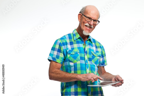 Photo: Well dressed senior man with tablet computer. Isolated. Well dressed senior man with tablet computer. Isolated.