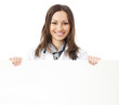 Foto: Happy doctor showing signboard, over white Happy doctor showing signboard, over white