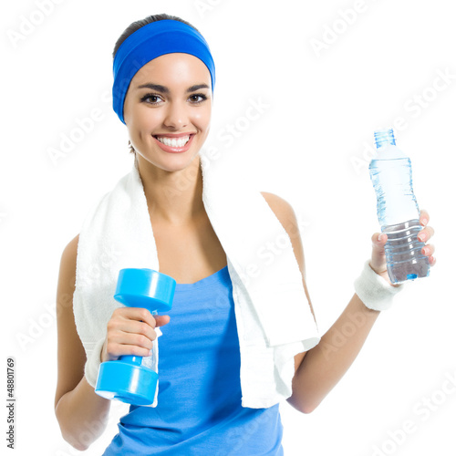 Photo: Woman with dumbbell and water, isolated Woman with dumbbell and water, isolated