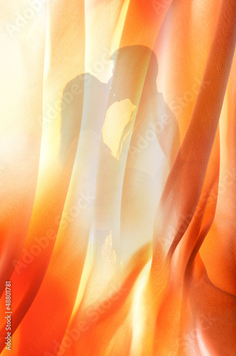 Photo: Silhouette of young couple kissing behind curtain Silhouette of young couple kissing behind curtain