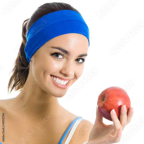 Photo: Young woman with apple, over white Young woman with apple, over white