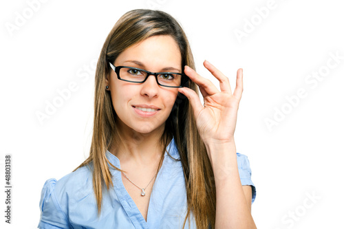 Photo: Pretty smiling young woman in black glasses Pretty smiling young woman in black glasses