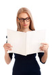 Young woman reading womens magazine
