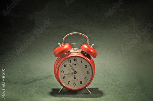 Photo: Red old style alarm clock Red old style alarm clock