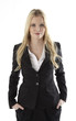 Portrait of a business woman with hands in pockets