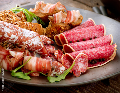 Photo: Sausage. Various Italian Ham, Salami and Bacon. Meat Food Sausage. Various Italian Ham, Salami and Bacon. Meat Food