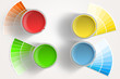 Four paint cans - yellow, red, blue, green on white background