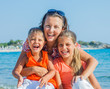Foto: Photo of happy family on the beach Photo of happy family on the beach