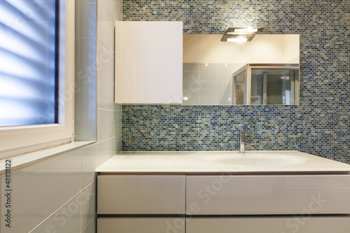 Photo: modern bathroom , detail, close up sink and mirror modern bathroom , detail, close up sink and mirror