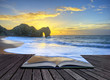 Vibrant sunrise over ocean with rock stack in foreground in page