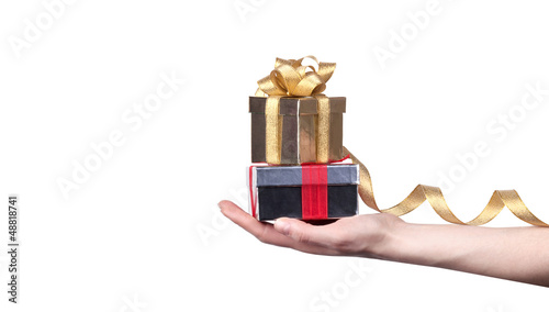 Photo: gift in hand isolated on white background gift in hand isolated on white background
