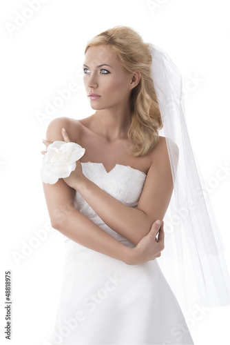 Photo: pretty blonde bride looks at right pretty blonde bride looks at right