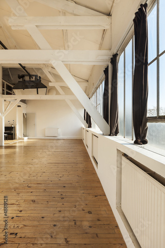 Photo: interior old loft, beams and wooden floor, big space interior old loft, beams and wooden floor, big space