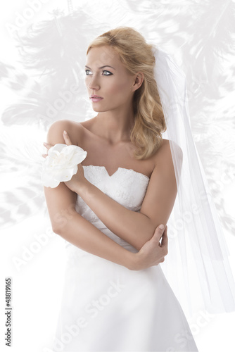Photo: pretty blonde bride looks at right pretty blonde bride looks at right