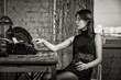 Elegant woman in black with the old typewriter