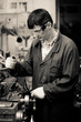 Industrial machinist operating machine tool