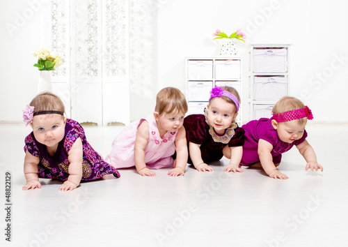 Photo: Toddler girls crawling Toddler girls crawling