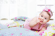 Photo: Little girl lying on the pillows Little girl lying on the pillows