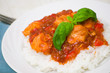 chicken breast with sauce and rice