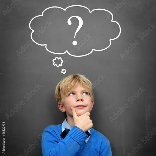 Photo: Child at the Blackboard with question Mark Child at the Blackboard with question Mark