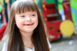 Portrait of beautiful young girl on the playground