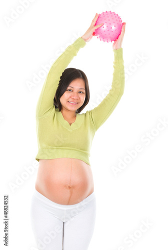 Photo: Asian pregnant woman exercising with yoga ball Asian pregnant woman exercising with yoga ball
