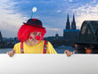 Clown mit Schild in Köln