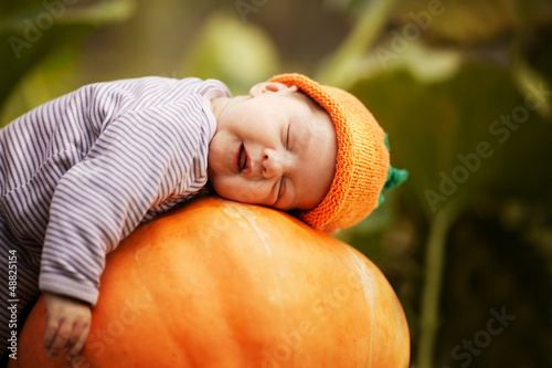 Photo: baby sleeping on big pumpkin baby sleeping on big pumpkin