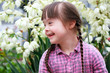 Portrait of young girl on flowers background