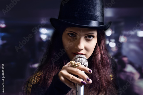 Photo: actress with microphone in nightclub actress with microphone in nightclub