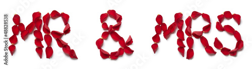 Photo: Red rose petals spelling mr and mrs Red rose petals spelling mr and mrs