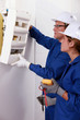 Photo: Electrical team installing a fusebox Electrical team installing a fusebox