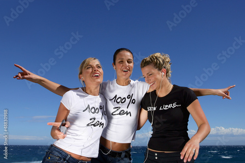 Photo: Three women dancing with mp3 players Three women dancing with mp3 players