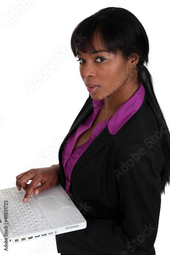 Photo: Woman holding laptop Woman holding laptop