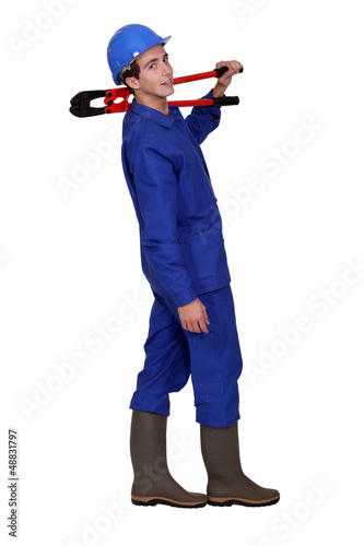 Photo: Builder with boltcutters Builder with boltcutters