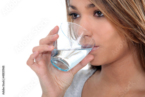 Photo: Woman drinking a glass of water Woman drinking a glass of water
