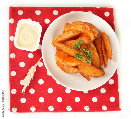 Photo: Appetizing village potatoes on plate isolated on white Appetizing village potatoes on plate isolated on white