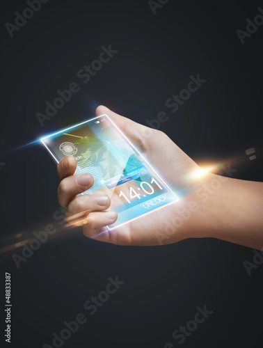 Photo: hand holding smart phone hand holding smart phone