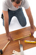 Carpenter working with wood planks