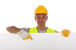 Construction worker wearing hard hat and vest