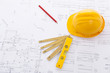 Hard hat and tools on a blueprint