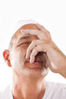 Portrait of man with hand on his face