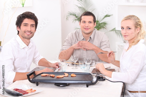 Photo: friends having diner friends having diner