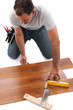 Carpenter working with wood planks
