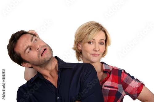 Photo: Wife pushing husband's head Wife pushing husband's head